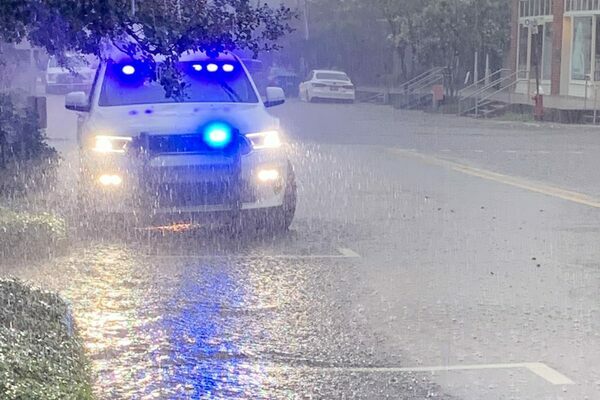 Meadville Police Chief Taylor McMinn was parked on Main Street in downtown Meadville on Thursday, June 30 to slow traffic during a torrential downpour that flooded area streets. Photo by Sean Dunlap/Franklin Advocate