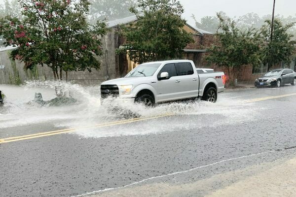 A truck splashes its way along Main Street in downtown Meadville on Thursday, June 30 as torrential rains flooded roads and businesses in the area. Photo by Sean Dunlap/Franklin Advocate